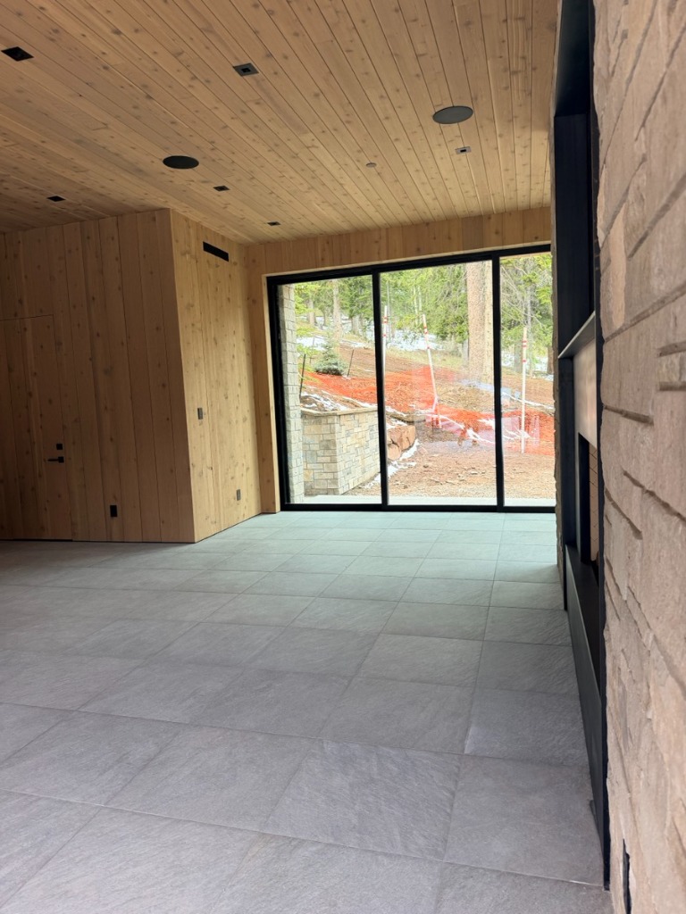 Vertical wood paneling with integrated door and T&G ceiling by Mastercraft Interiors