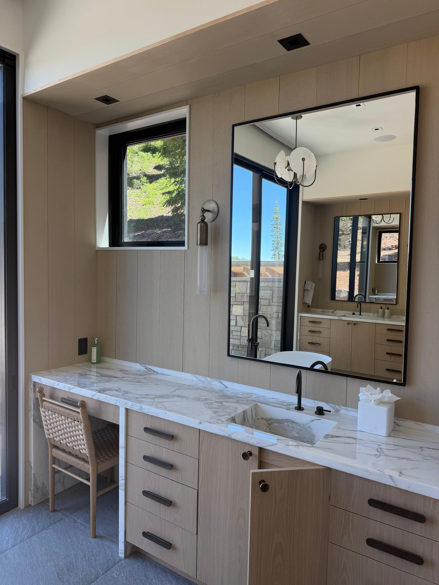 Finished bathroom vanity with custom millwork, mirror integration, and refined interior detailing